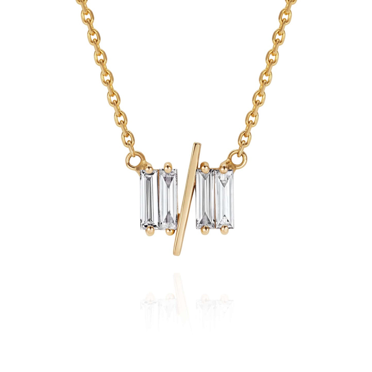 Close up of 11/11 necklace in yellow gold – featuring a thin yellow gold chain, and pendant featuring 4 long thin diamonds, with a thin diagonal gold bar, to look like the ‘11/11’ symbol.
