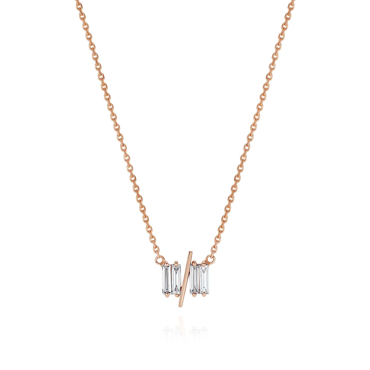 11/11 necklace in rose gold - featuring a thin rose gold chain, 4 long thin diamonds, with a thin diagonal gold bar, to make the ‘11/11’ symbol.