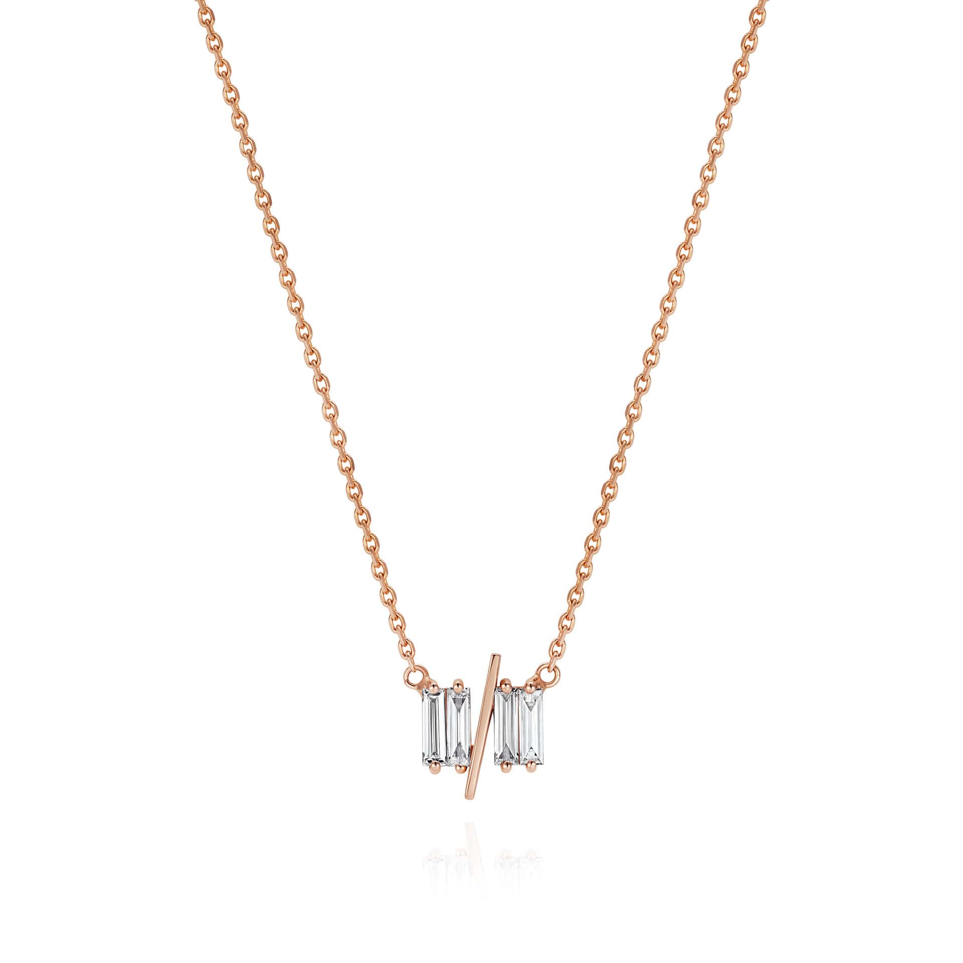 11/11 necklace in rose gold - featuring a thin rose gold chain, 4 long thin diamonds, with a thin diagonal gold bar, to make the ‘11/11’ symbol.