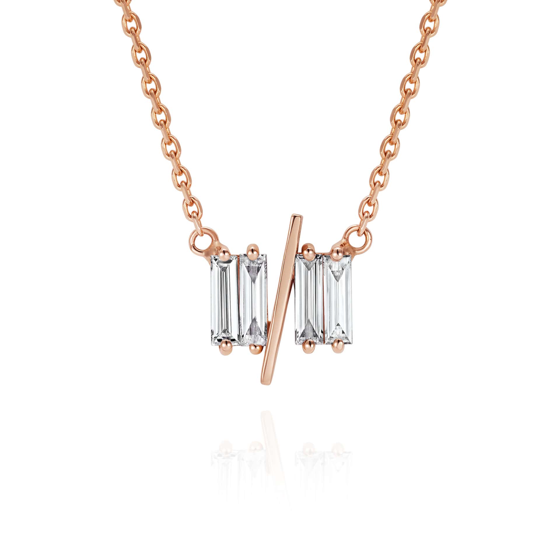 Close up of 11/11 necklace in rose gold - featuring a thin rose gold chain, 4 long thin diamonds, with a thin diagonal gold bar, to make the ‘11/11’ symbol.