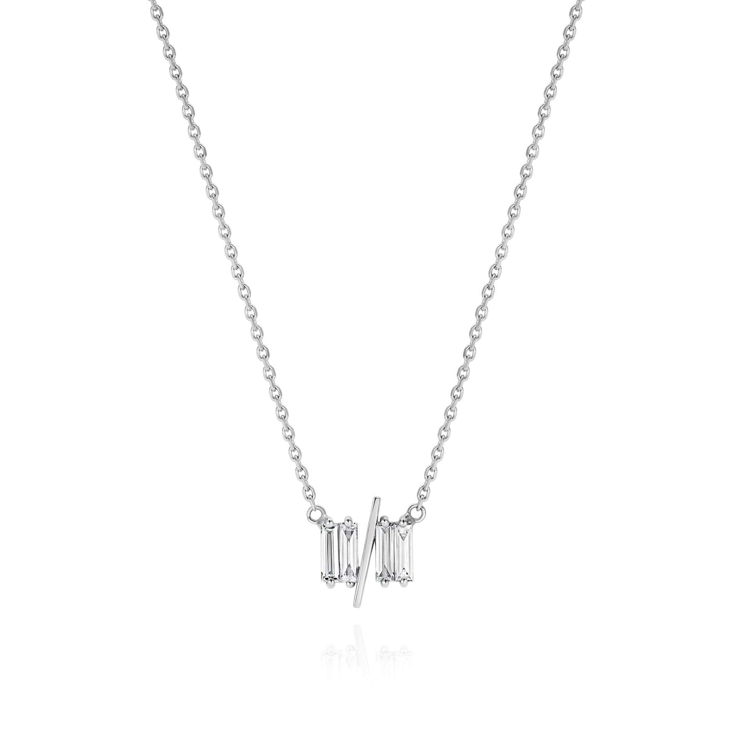 11/11 necklace in white gold - featuring a thin white gold chain, 4 long thin diamonds, with a thin diagonal gold bar, to make the ‘11/11’ symbol.