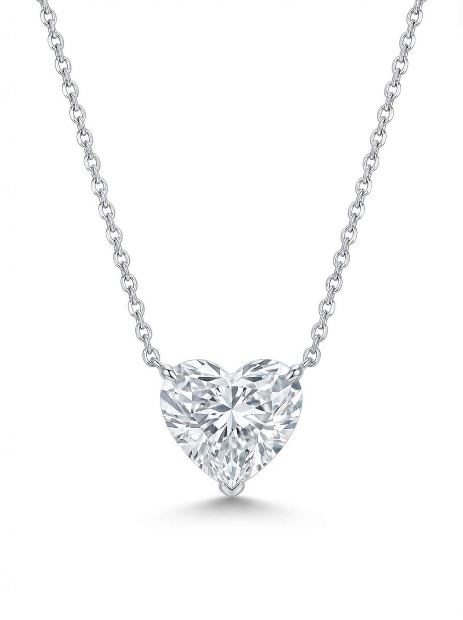 Heart-shaped diamond necklace on a white background