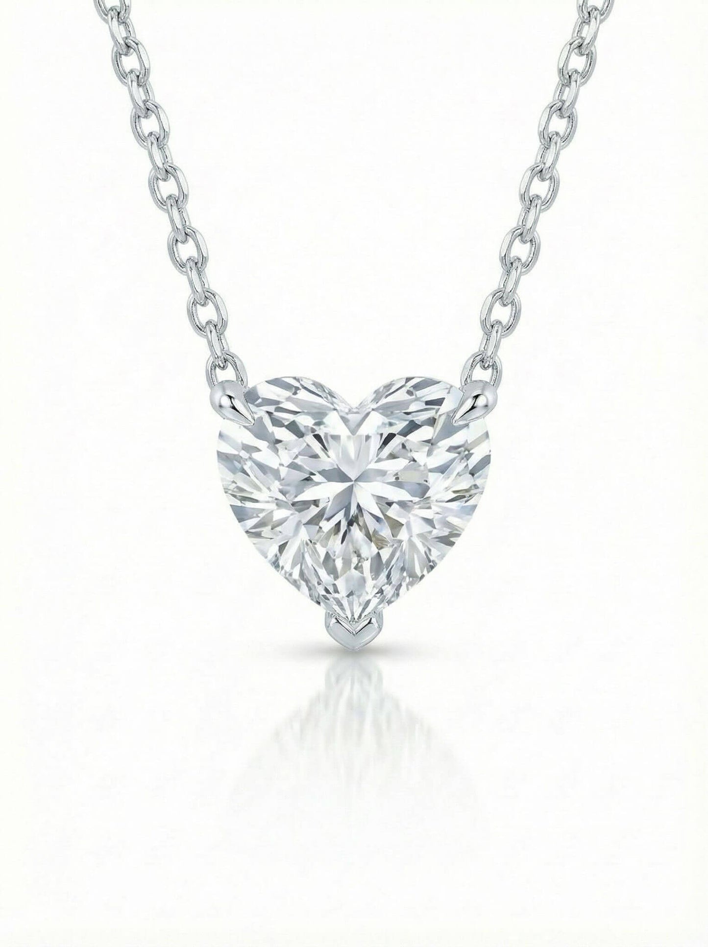 Heart-shaped diamond pendant on a white background