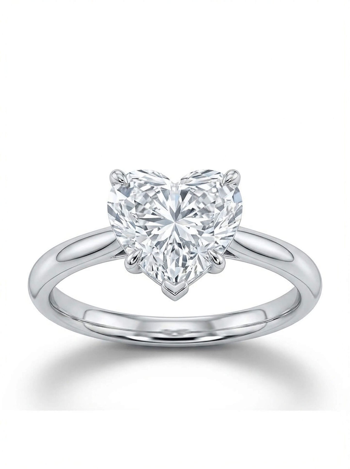 Heart-shaped diamond ring on a white background