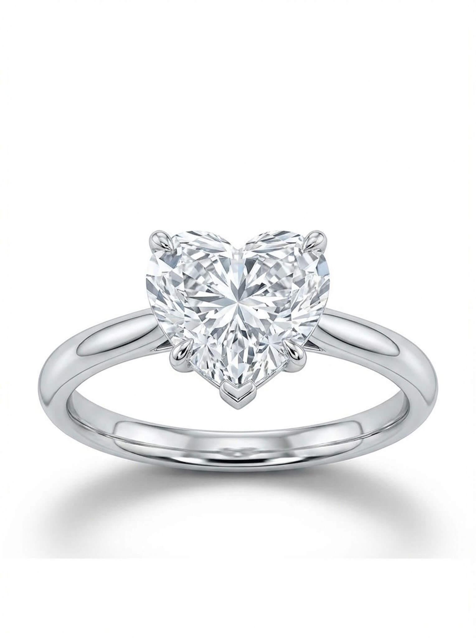 Heart-shaped diamond ring on a white background