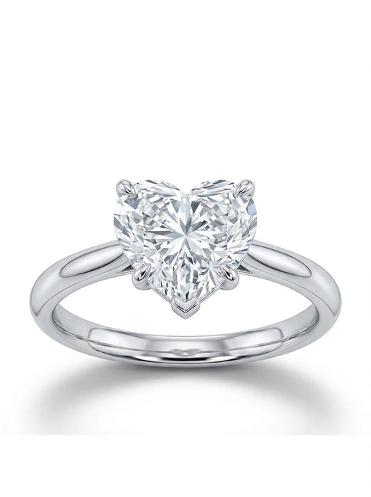 Heart-shaped diamond ring on a white background
