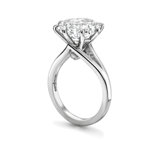 Platinum diamond ring with a white background