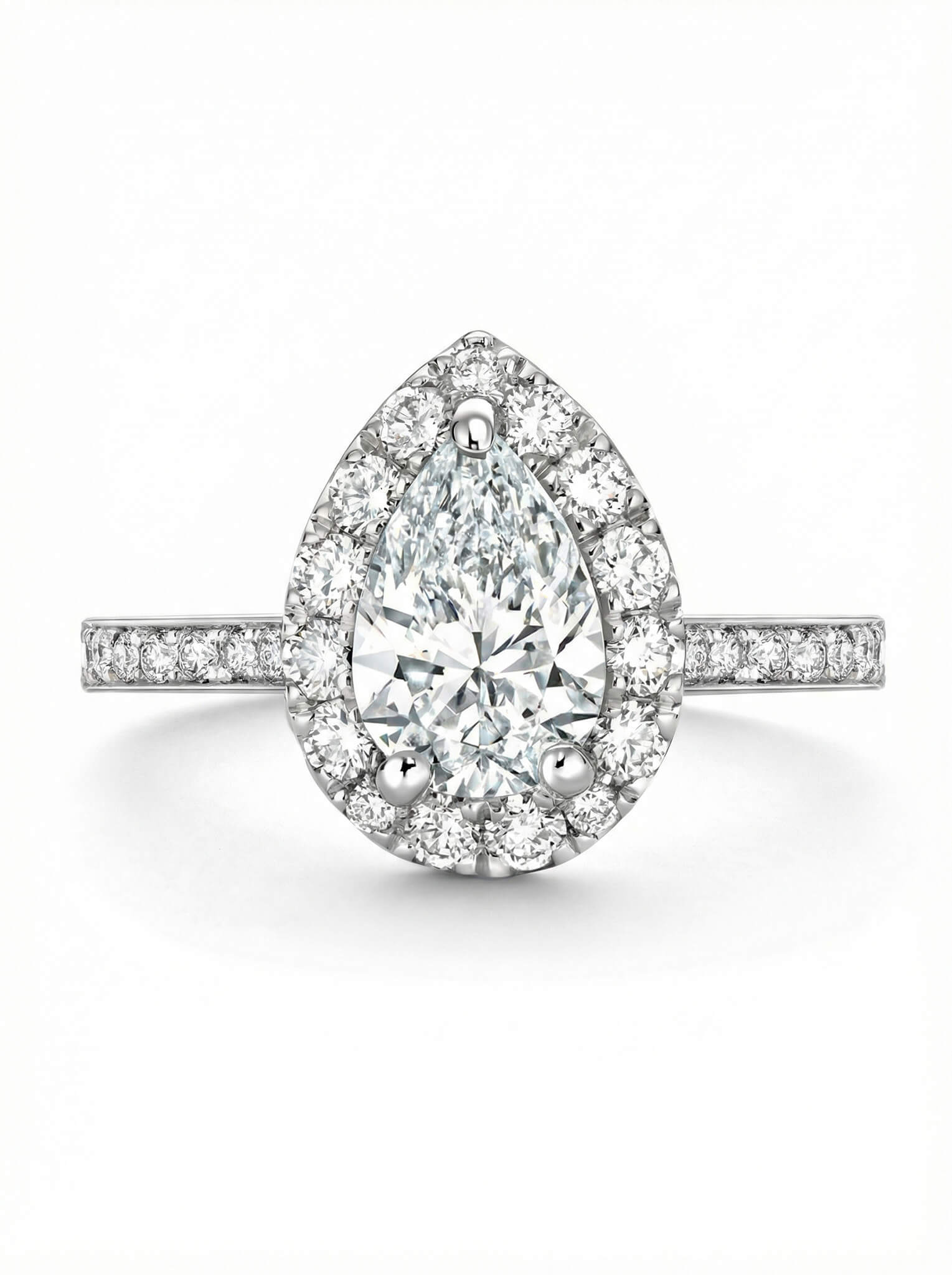 Diamond ring with a pear-shaped center stone on a white background