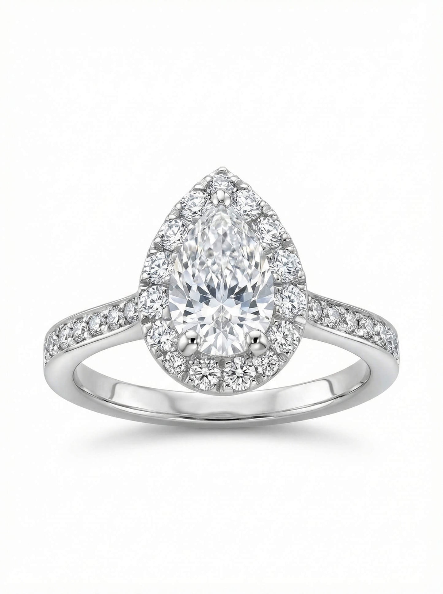Diamond ring with pear-shaped center stone on a white background
