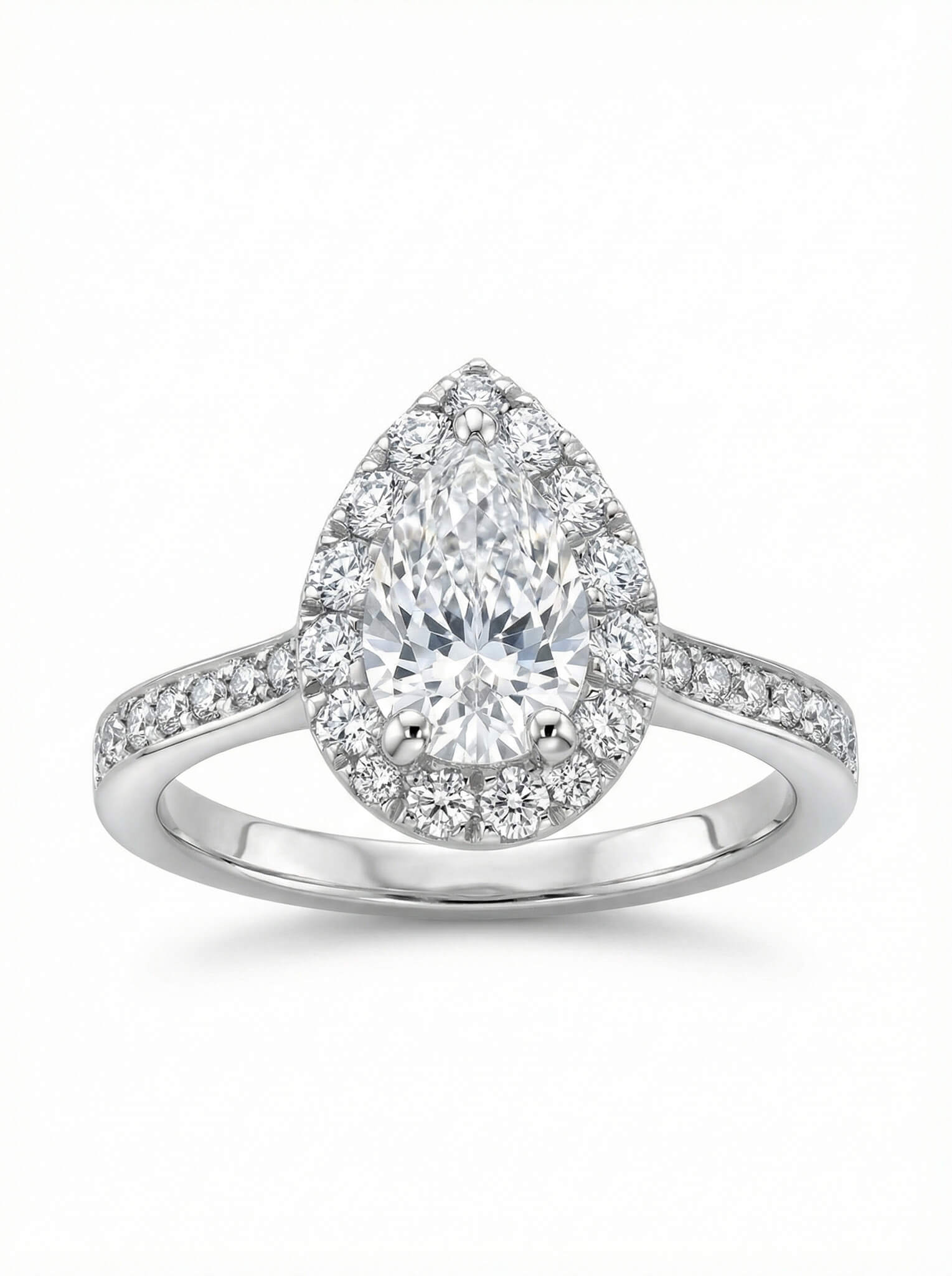 Diamond ring with pear-shaped center stone on a white background